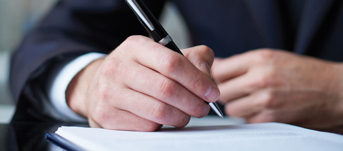 Man holding pen in business suit